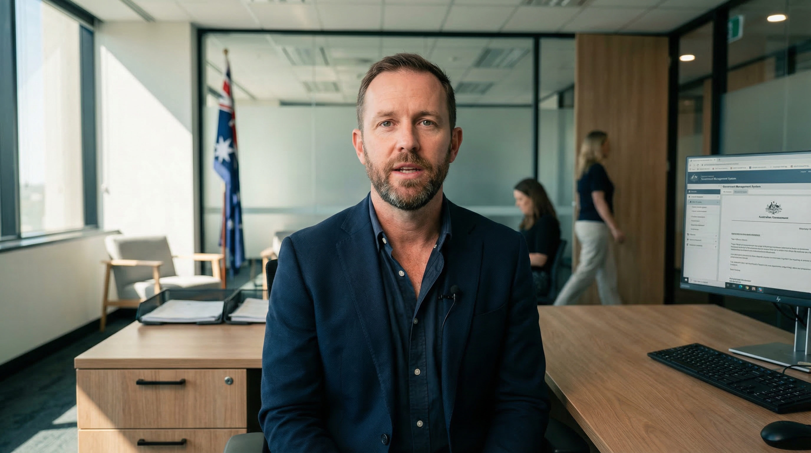Male government officer dictating correspondence in an Australian government office
